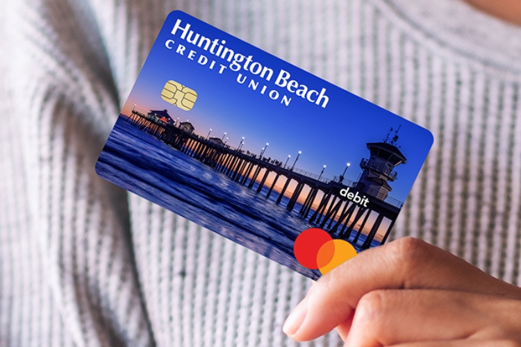 Woman holding HBCU's Mastercard debit card