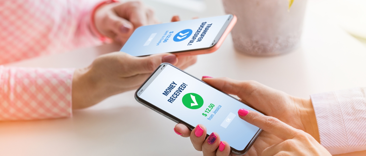 People transferring money from one mobile phone to another