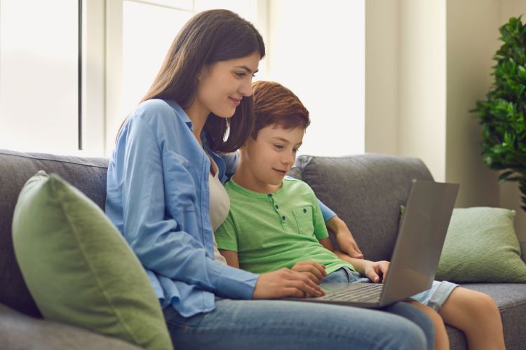 Mom and son using the laptop